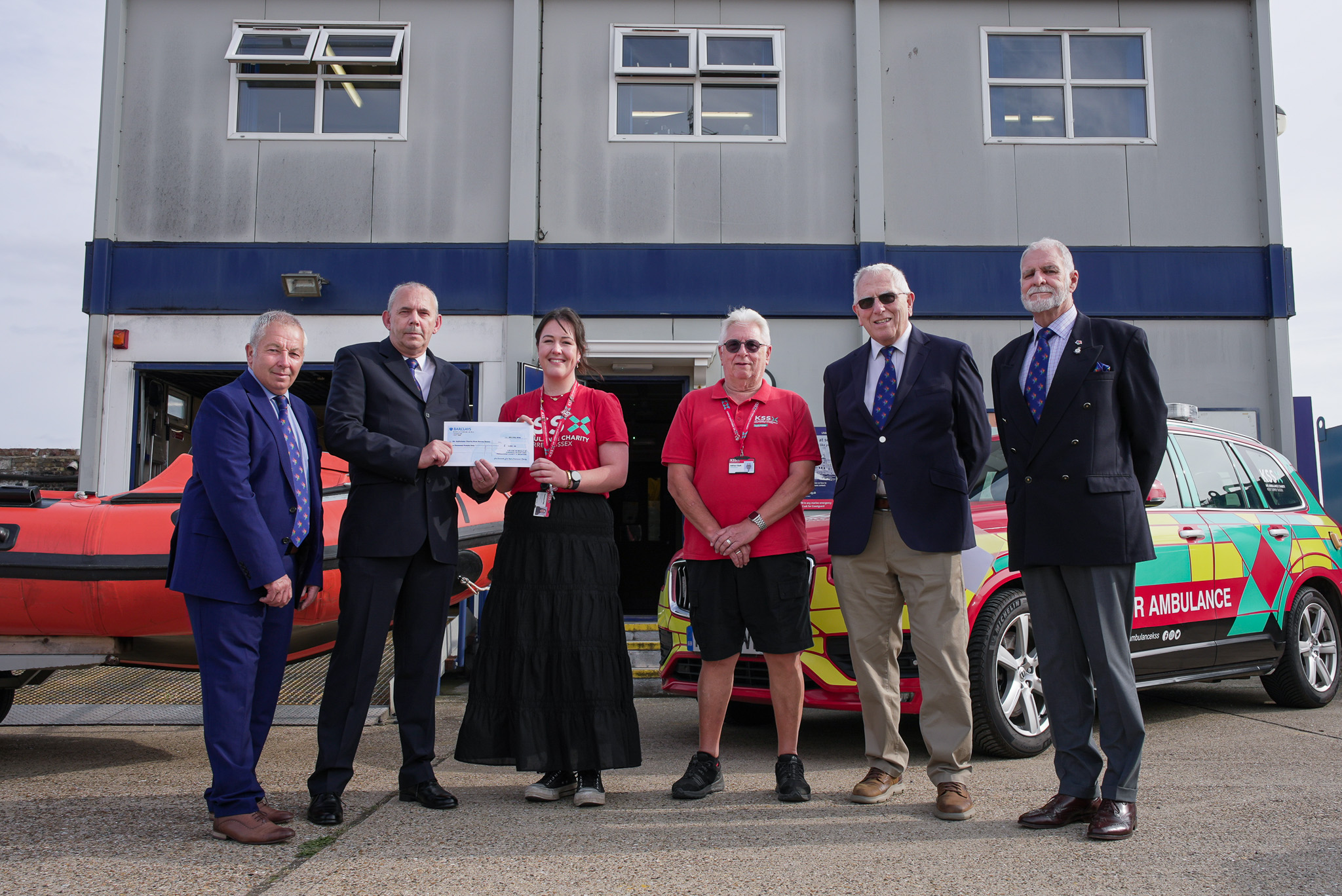 A picture of Peter West presenting the cheque to Dot Fisk the Group Coordinator.